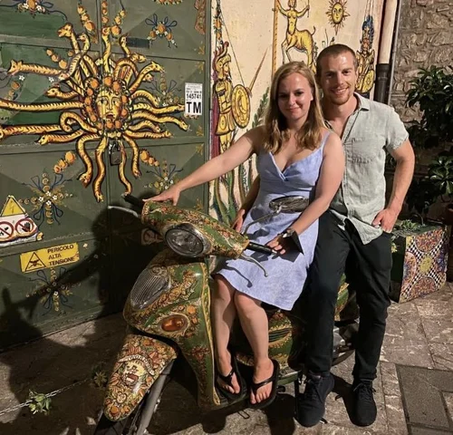 Nick and Caitlin sharing a fun moment in Taormina.