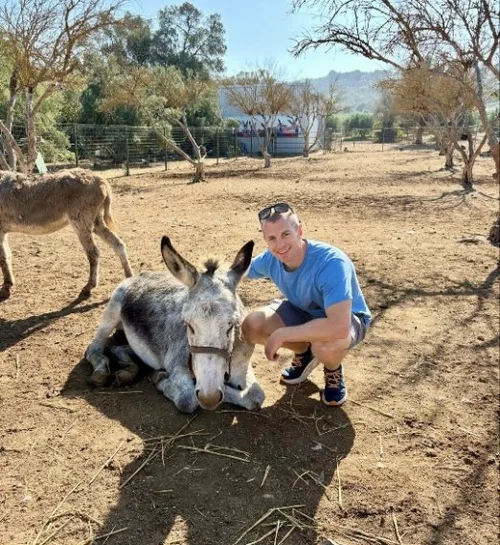 Nick with a small donkey in Crete.