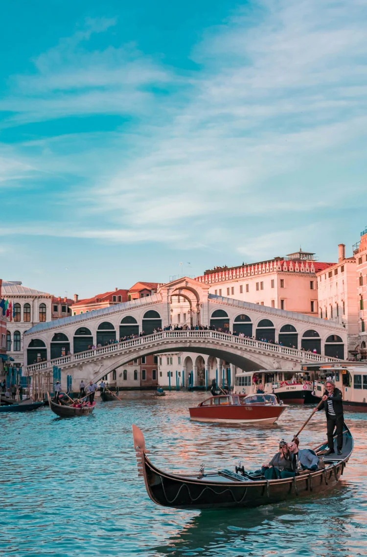 Gondolas on the Grand Canal near the Rialto Bridge in Venice, Italy.
